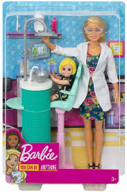 Barbie doll in a science lab outfit with lab coat and hair dryer, on a blue background available at Juniors Toys