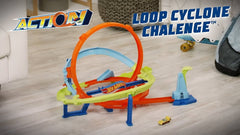 Toy track set with cars on a wooden floor, featuring 'Action!' and 'Loop Cyclone Challenge' branding available at Juniors Toys
