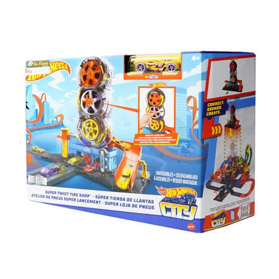 Hot Wheels City Super Twist Tire Shop box showing a stack of three large spinning tires and a yellow car available at Juniors Toys