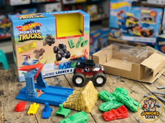 Open view of Hot Wheels Monster Truck play set including ramp and crushable cars available at Juniors Toys