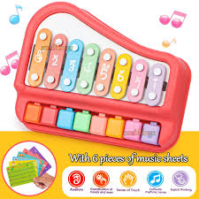 Colorful toy keyboard with music sheets on a yellow background available at Juniors Toys