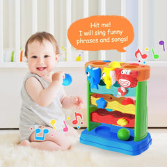 Child playing with a colorful toy that sings phrases and songs, with a child sitting next to it available at Juniors Toys