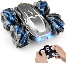 Toy robot with blue lights and a remote control held by a person available at Juniors Toys