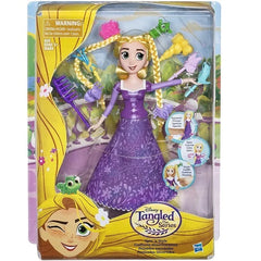 Tangled doll in packaging with yellow hair and purple dress available at Juniors Toys