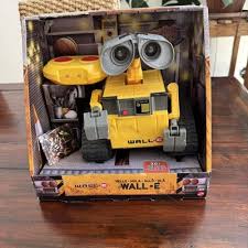 Toy robot in a box on a wooden surface available at Juniors Toys 