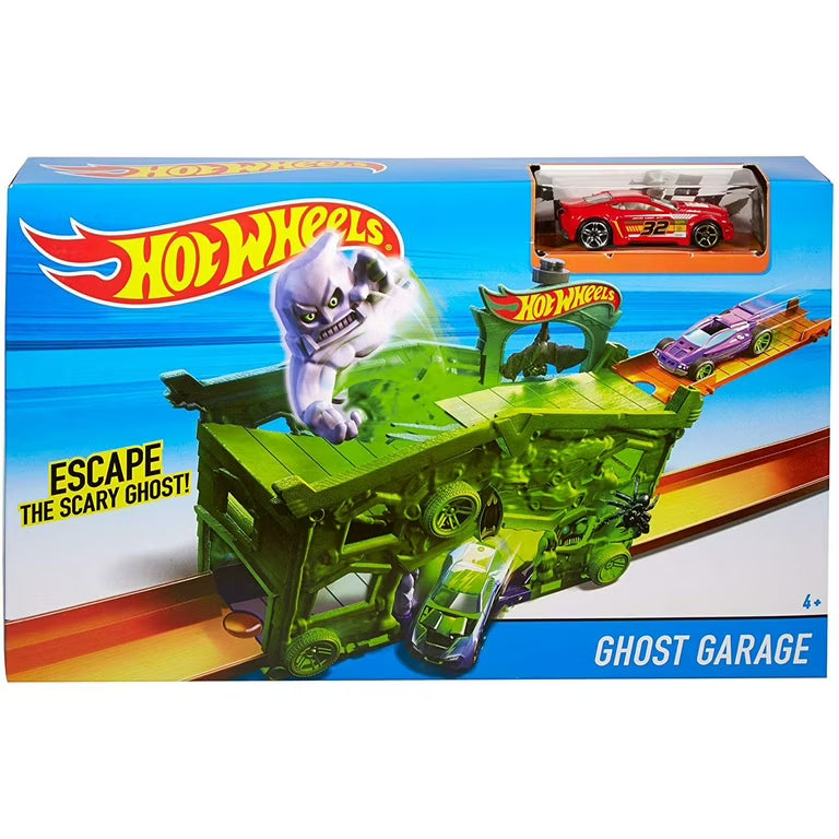 An open Hot Wheels Ghost Garage playset featuring a purple slime creature and Hot Wheels cars on a display table next to its box available at Juniors Toys