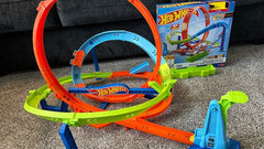 Front view of the Loop Cyclone Challenge packaging with a yellow die-cast car visible in the top corner available at Juniors Toys