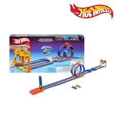 Action shot of the Hot Wheels Wild Drive Drag Race playset with the starting gate and looping tracks ready for racing available at Juniors Toys