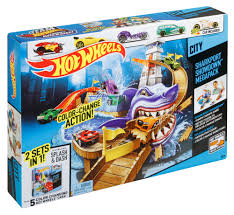 Action shot of Hot Wheels cars escaping a shark on the Sharkport Showdown track available at Juniors Toys