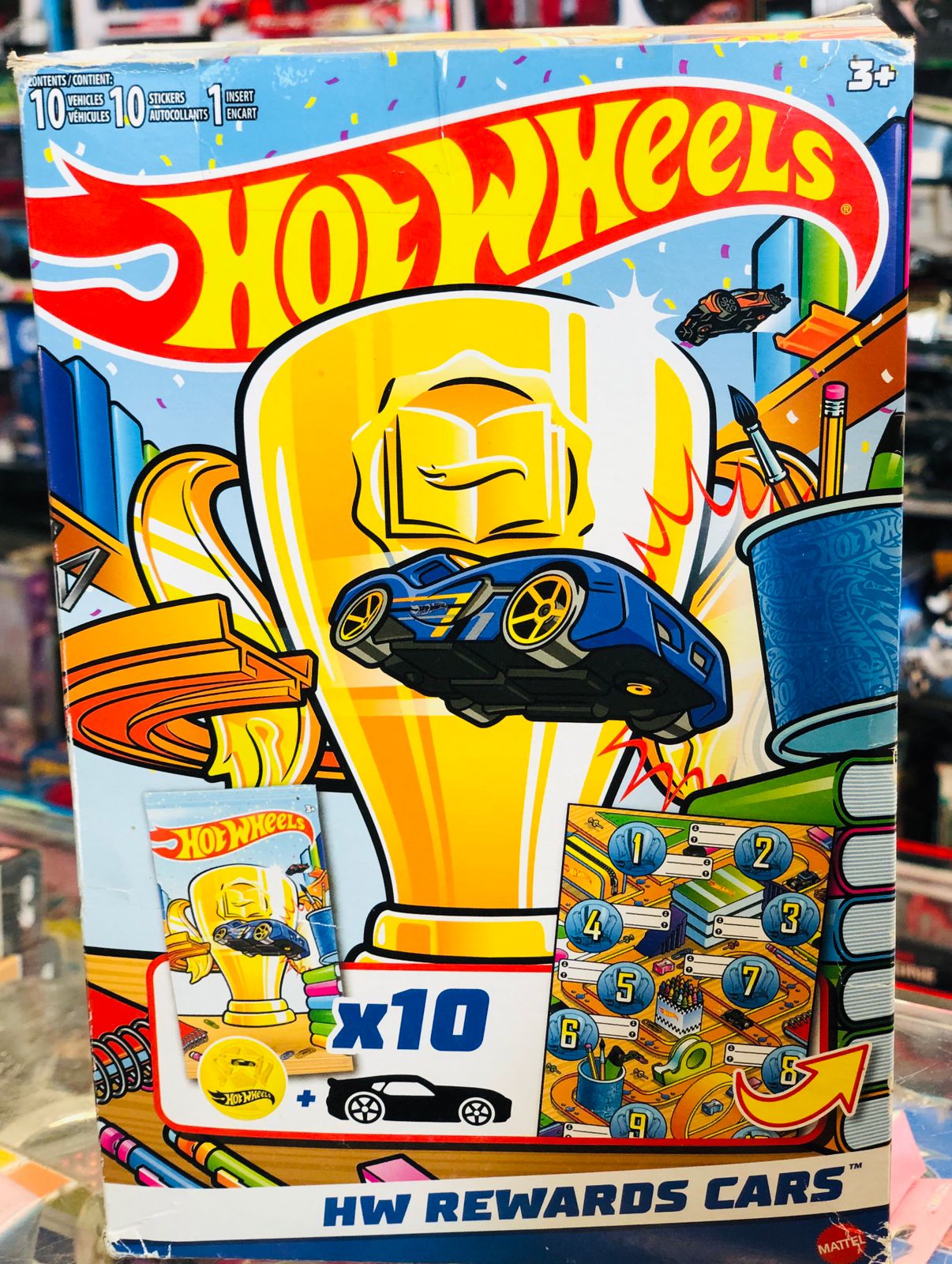 Hot Wheels HW Rewards Cars 10-pack featuring a gold trophy and blue sports car available at Juniors Toys