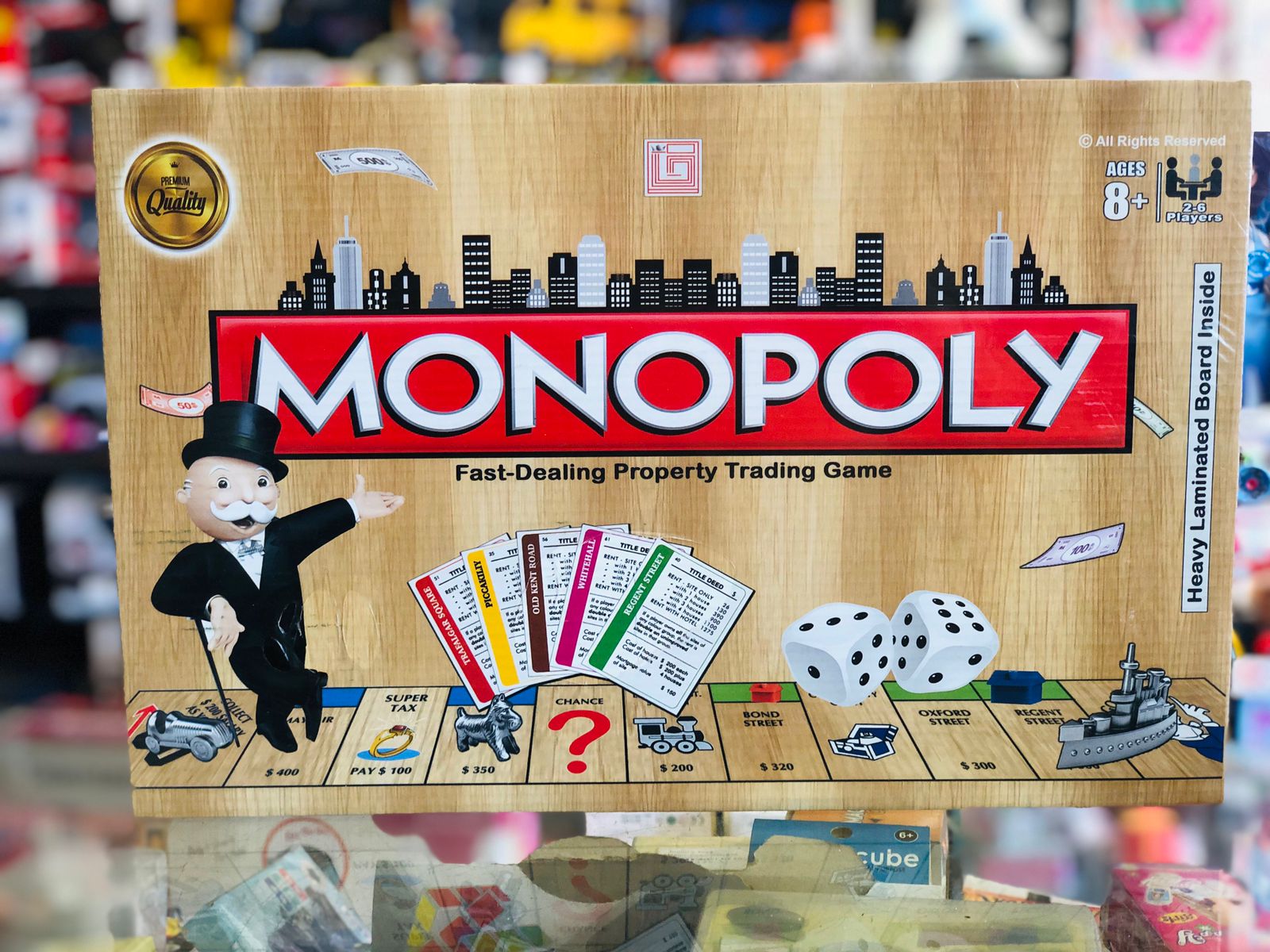 Monopoly board game box with colorful design and text available at Juniors Toys