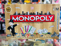 Monopoly board game box with colorful design and text available at Juniors Toys