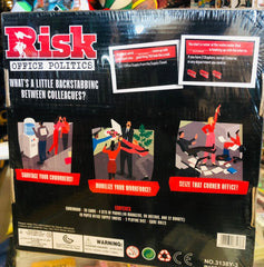 Risk Office Politics game box with illustrations and text on a blurred background available at Juniors Toys