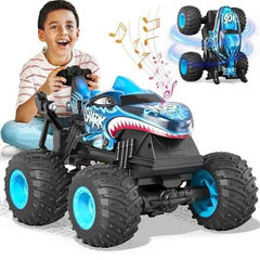 Child playing with a toy monster truck featuring music notes, with another similar toy in the background available at Juniors Toys