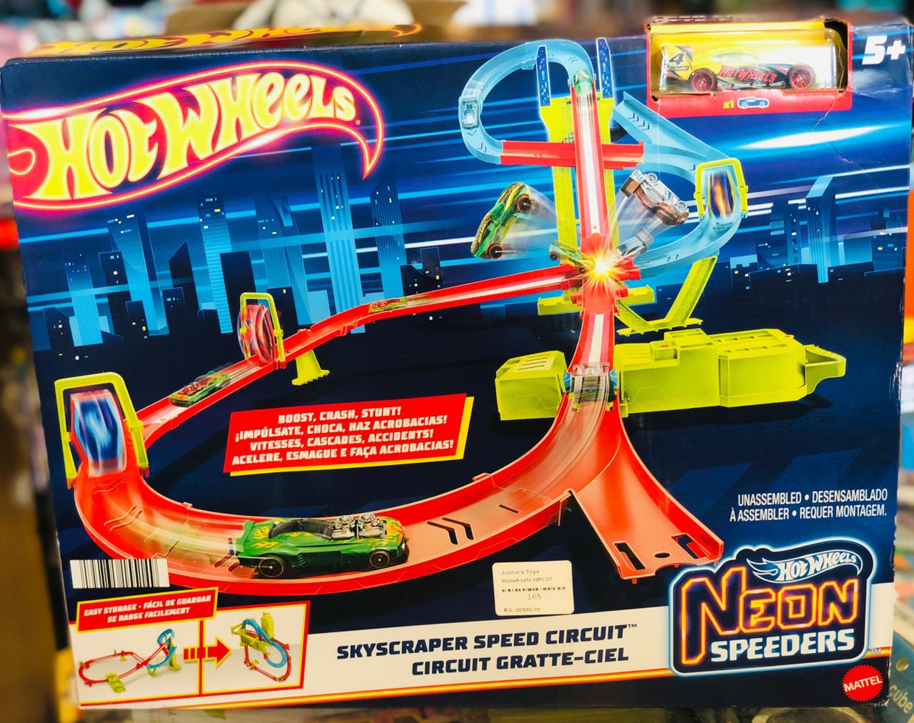 Front view of the Hot Wheels Neon Speeders Skyscraper Speed Circuit toy set box featuring a vibrant city-themed track and motorized booster available at Juniors Toys
